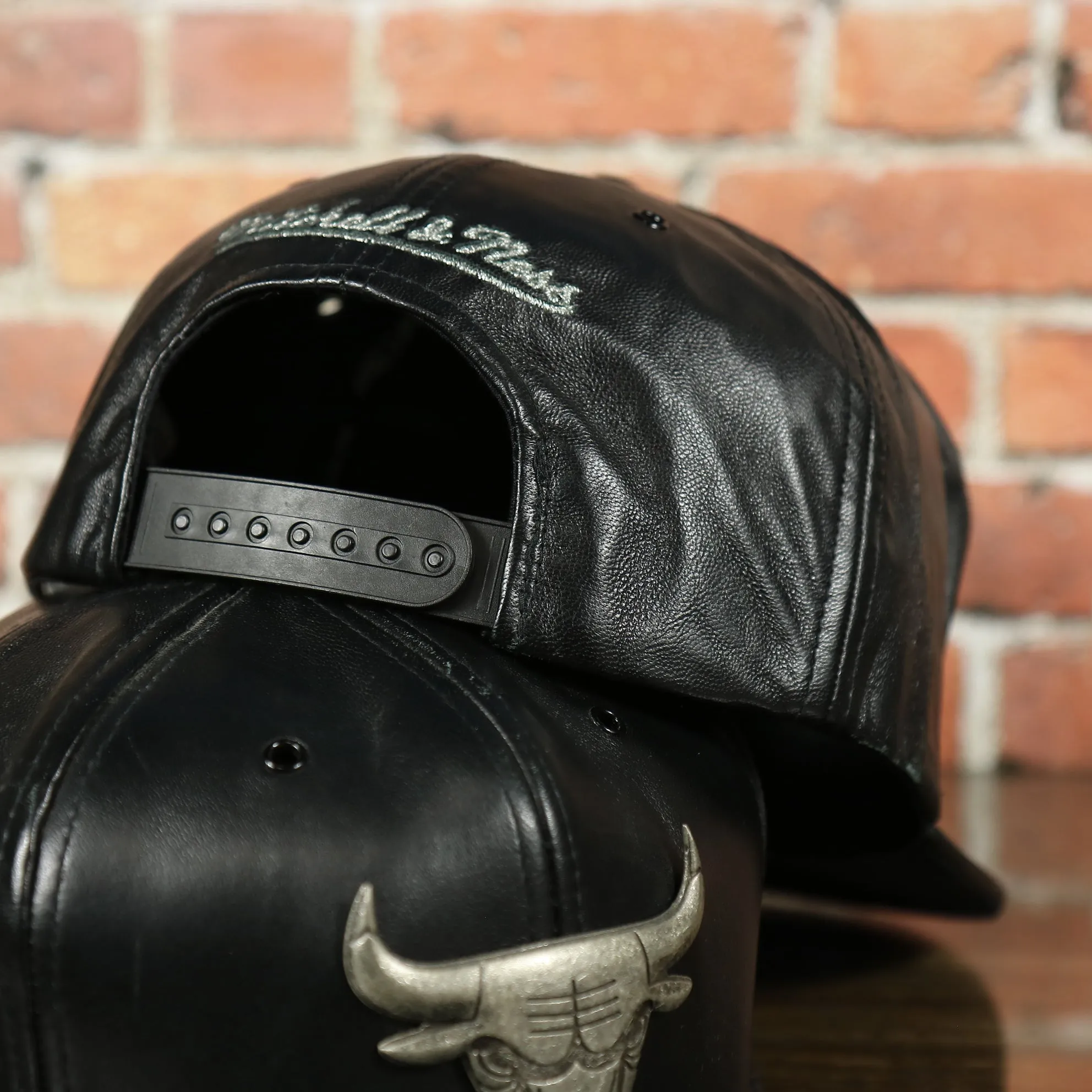 Chicago Bulls 100% Genuine Lambskin Leather Metallic Embossed Bull Logo Mitchell and Ness Black Snapback Hat